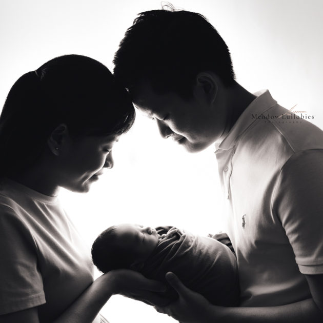 Newborn Photographer Singapore Parents with newborn silhouette shot