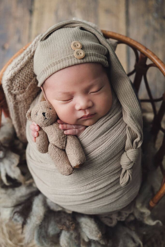 Newborn photography with teddy bear
