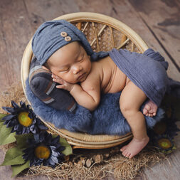 Newborn photography baby in rustic blue setup