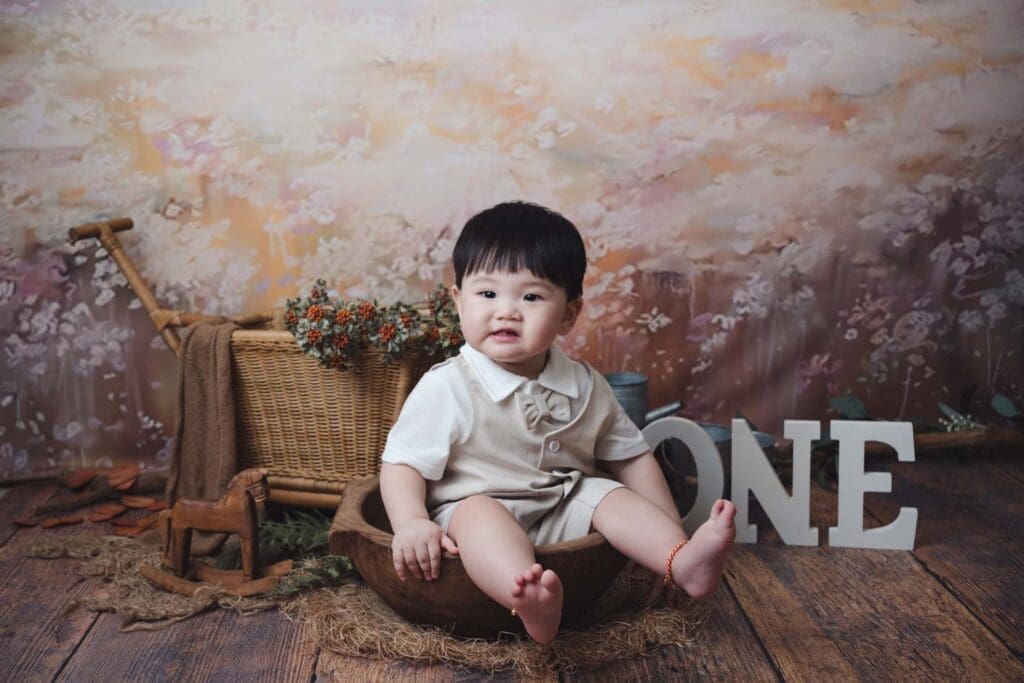 1 year old baby looking at his Daddy making funny faces.